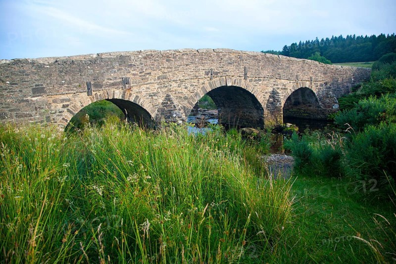 Historic Packhorse bridge at Postbridge, Dartmoor national park, Devon, England, UK crossing the East Dart river