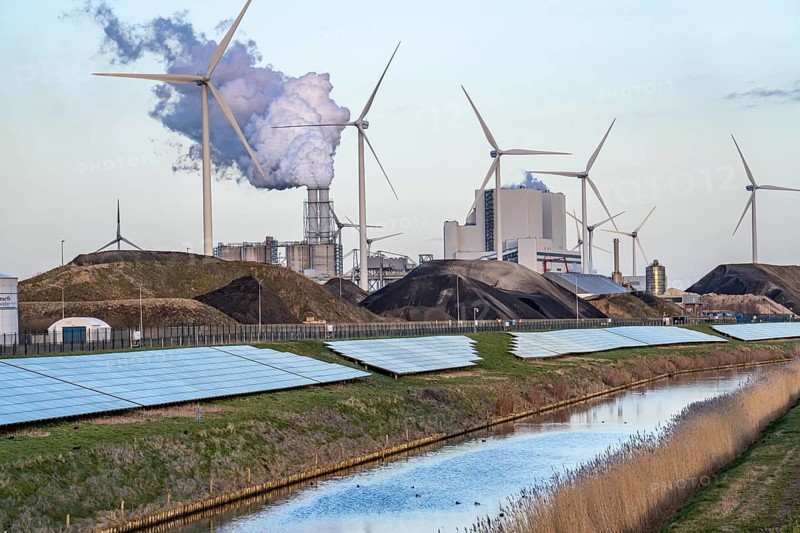 Solar park on the Slaperdijk dyke near the Eemshaven, test project, 17, 000 solar modules were installed over a good 5 kilometres, the Netherlands has over 22, 000 kilometres of dyke line, here it is being tested whether such an installation is successful and can be expanded, wind farm, behind the RWE coal-fired power plant Eemshavencentrale Groningen, Netherlands