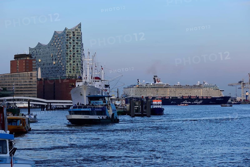 Germany, Hamburg, HafenCity, view to Elbe Philharmonic Hall, Hamburg's new concert hall, glass facade, museum ship Cap San Diego, former cargo ship, Mein Schiff 6, arriving, evening light, passenger ship turning in front of the Elbe Philharmonic Hall, Hamburg, Hamburg, Federal Republic of Germany, Europe