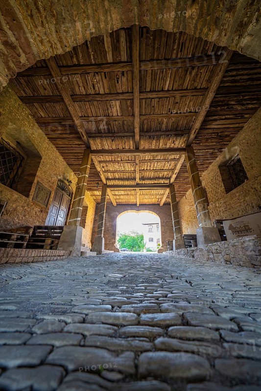 Interior view of a covered bridge with cobblestones and a wooden beam ceiling, Harz Mountains, Germany, Europe