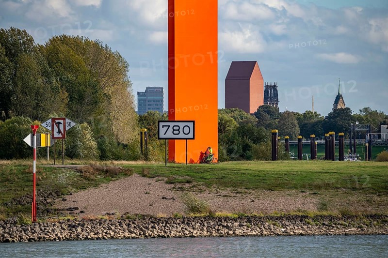 The sculpture Rhine Orange at the mouth of the Ruhr into the Rhine, skyline of the city centre of Duisburg, tower of the North Rhine-Westphalia State Archive, town hall tower and Salvator Church, North Rhine-Westphalia, Germany, Europe