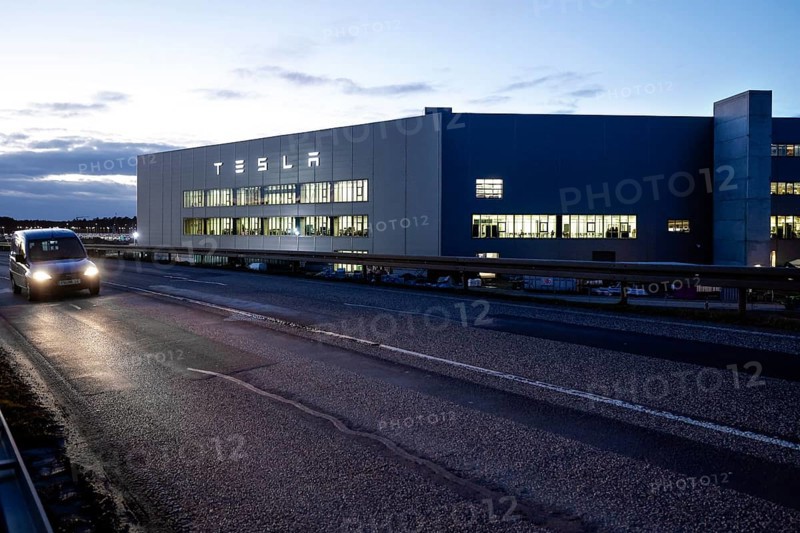 A car drives past the battery factory of the Tesla plant, Grünheide, 13.01.2023