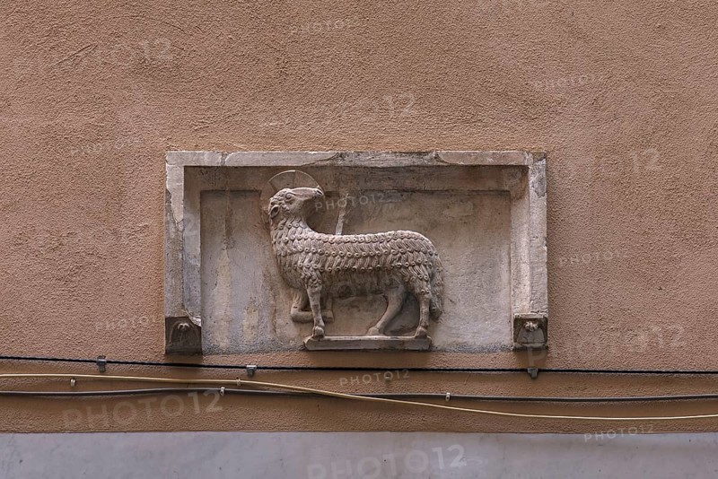 Sculpture of the Lamb of God above an entrance door, historic city centre, Genoa, Italy, Europe