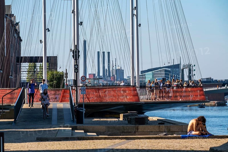 Cyclists on the Cirkelbroen cycle and pedestrian bridge, over the harbour, in the Christianshavens district, Copenhagen is considered the cycling capital of the world, 45 % of the population travel by bike, Denmark, Europe