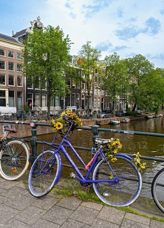 Bicycle on a bridge over Singel canal, Amsterdam, Netherlands