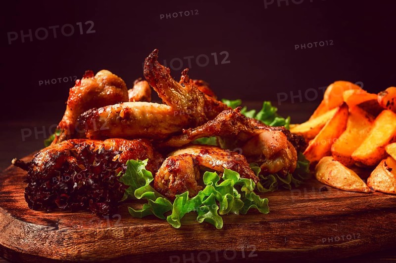 Fried chicken wings, with potatoes, and spices, homemade, fast food, no people