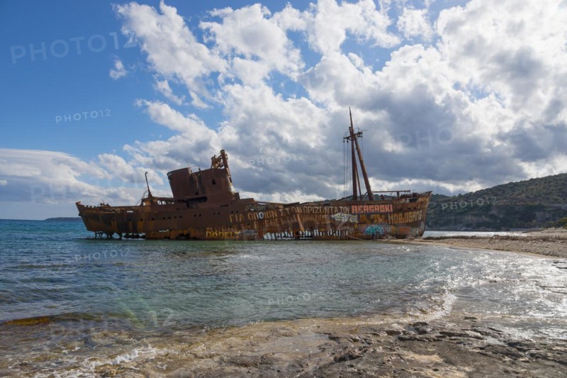 Rusty shipwreck on a sunny beach with blue sky and clouds, Shipwreck Dimitrios, Glyfada beach, Selinitsa, Gythio, Githio, Gythion, Mani, Laconia, Peloponnese, Greece, Europe