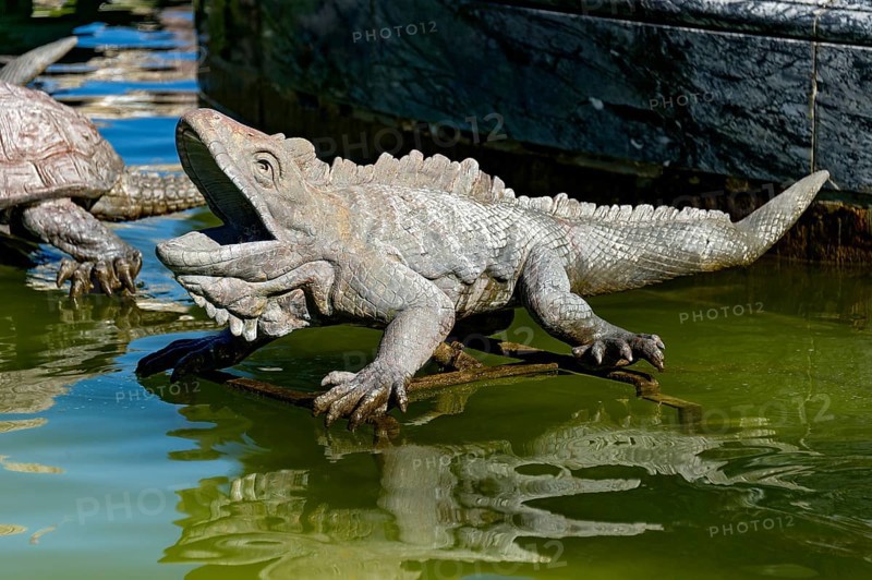 Animal figure of an iguana as a gargoyle, Latona fountain, Latona fountain, fountain, castle park, Herrenchiemsee Castle, Herreninsel, Chiemsee, Chiemgau, Upper Bavaria, Bavaria, Germany, Europe
