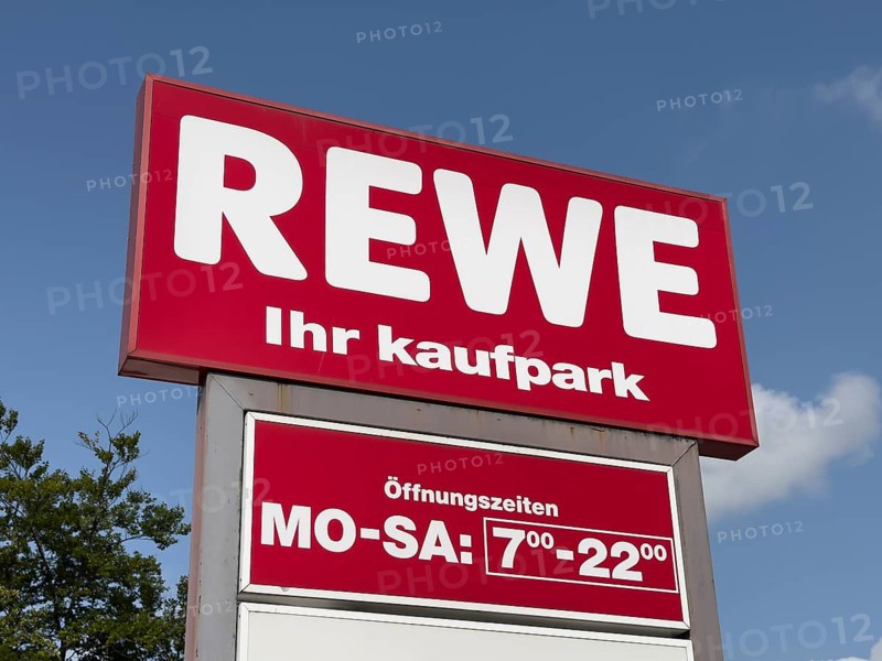 Signboard billboard with logo of retail chain retailer REWE ihr Kaufpark including long opening hours Monday to Saturday 7 am to 10 pm, Germany, Europe