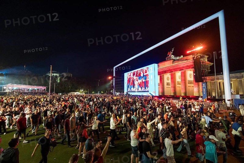 Football fans leaving the fan zone at the Brandenburg Tor after the final match between Spain and England at the European Football Championship, Berlin, 14 July 2024