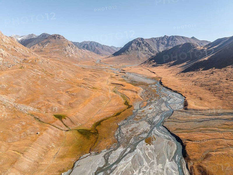 Aerial view, Burkhan mountain valley with meandering river, barren dramatic mountain landscape, Terskey Ala-Too, Tien Shan, Issyk Kul province, Kyrgyzstan, Asia