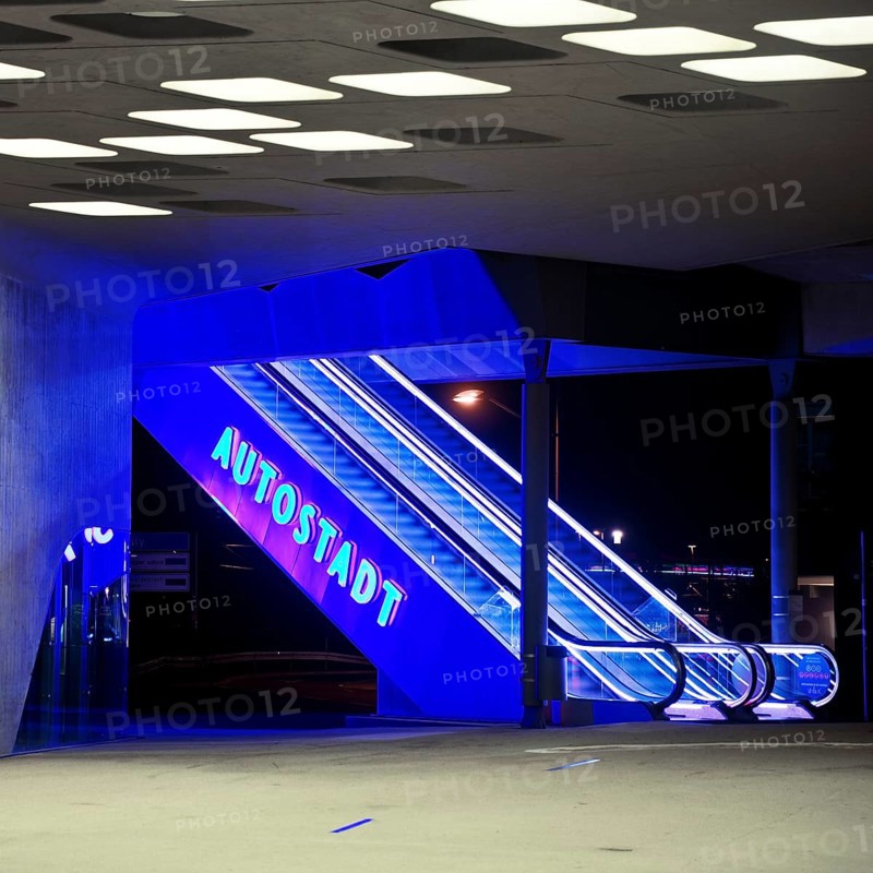 Illuminated escalator to the Autostadt under the phæno building at night, Wolfsburg, Lower Saxony, Germany, Europe