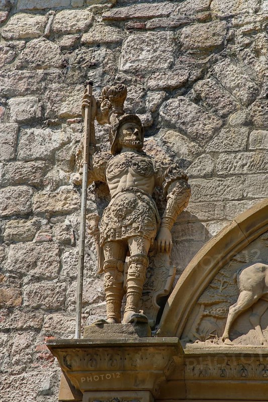 Stone figures, statue, male warrior above portal, detail, armour, weapons, decoration, Hohentübingen Palace, Museum of the University of Tübingen MUT, higher education institution, historical building, place of learning, Renaissance complex built in the 16th century, Eberhard Karls University of Tübingen, Tübingen, Baden-Württemberg, Germany, Europe