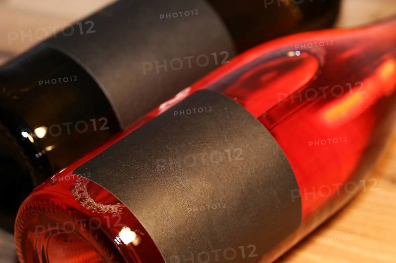 Close-up of two horizontal wine bottles