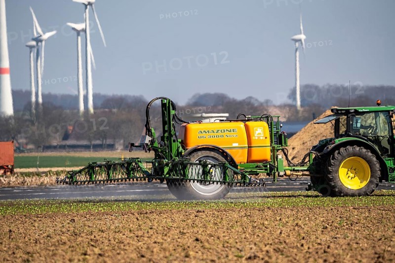 Wind turbine, near Kerken, Kleve district, on the Lower Rhine, farmer applies pesticide, North Rhine-Westphalia, Germany, Europe