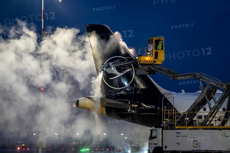 Winter at Frankfurt Main Airport, FRA, Lufthansa aircraft being de-iced by de-icing vehicles, Hesse, Germany, Europe