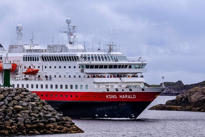 Ship 'Kong Harald' of Hurtigruten company is approaching harbor of Stamsund, island Vestvagøy, Lofoten, Norway, Europe