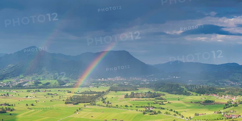 Panorama from Grünten over the Illertal with rainbow to Blaichach and Immenstadt, behind Steineberg, 1660m and Mittagberg, 1451m, Allgäu Alps, Allgäu, Bavaria, Germany Europe
