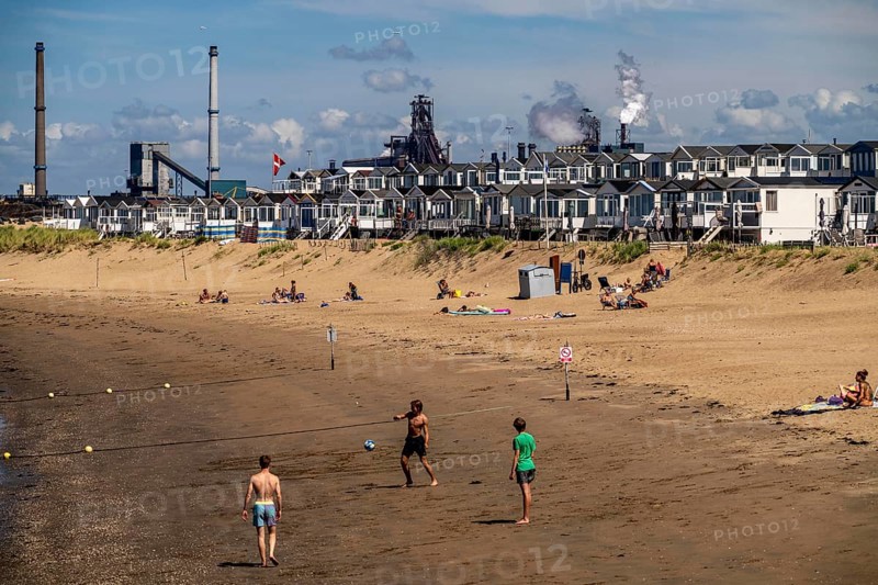 The Tata Steel steel and smelting works in IJmuiden, Velsen, North Holland, Netherlands, largest industrial area in the Netherlands, 2 blast furnaces, 2 coking plants, rolling mills, directly on the North Sea, beach houses near Ijmuiden aan Zee