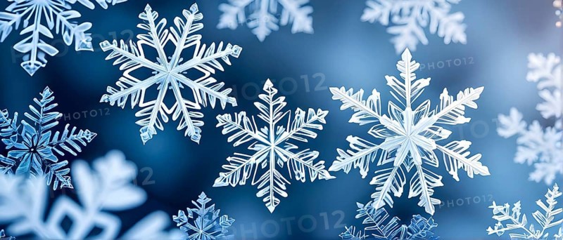Abstract pattern of snowflakes in varying sizes and shapes in soft white and blue gradients, AI generated