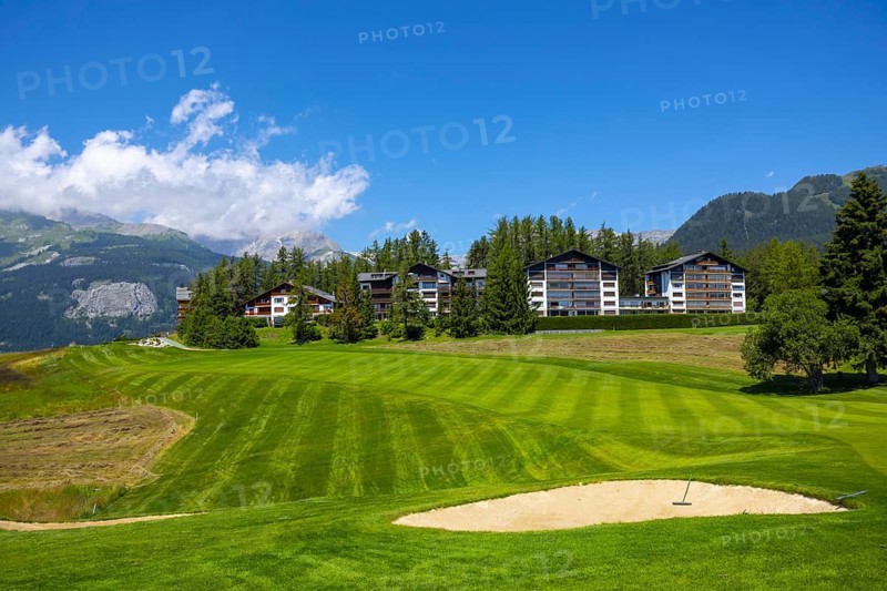 Crans Sur Sierre Golf Course with House and Mountain View in Crans Montana in Valais, Switzerland, Europe