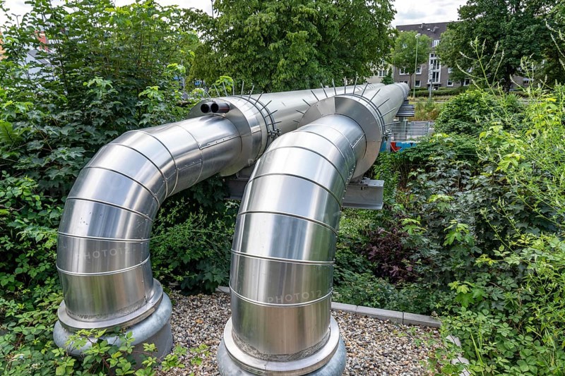 New STEAG district heating pipeline in Essen, over the railway tracks of the S6 line in Essen-Süd, part of the new 12 km long eastern route through the city, North Rhine-Westphalia, Germany, Europe