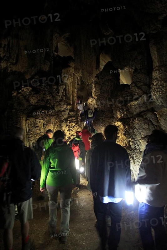 People inside caves, Cueva de la Pileta, near Ronda, Malaga province, southern Spain