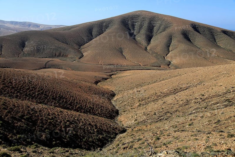 Bare moon-like arid landscape in mountains between Pajara and La Pared, Fuerteventura, Canary Islands, Spain, Europe