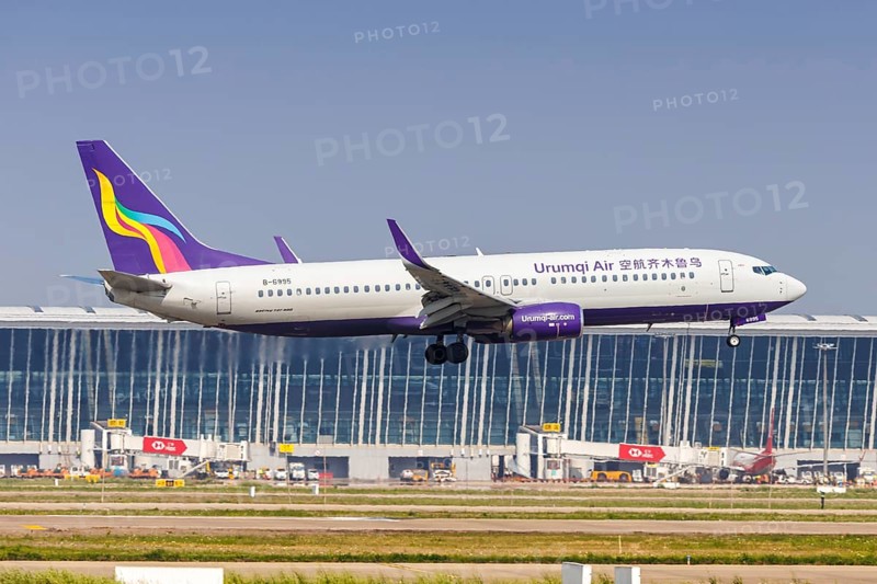 A Boeing 737-800 aircraft of Urumqi Air with the registration number B-6995 at Pudong Airport (PVG) in Shanghai, China, Asia