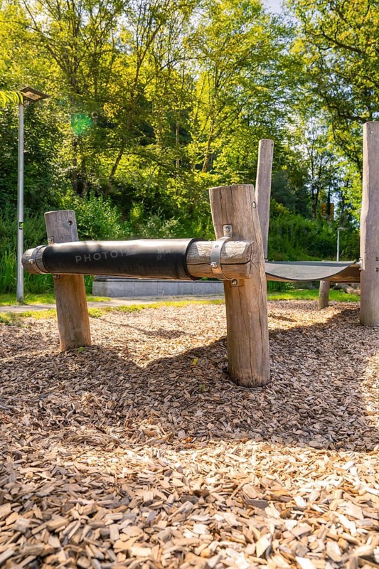 Close-up of a wooden bridge on a playground with wood chips as flooring, Nagold, Black Forest, Germany, Europe