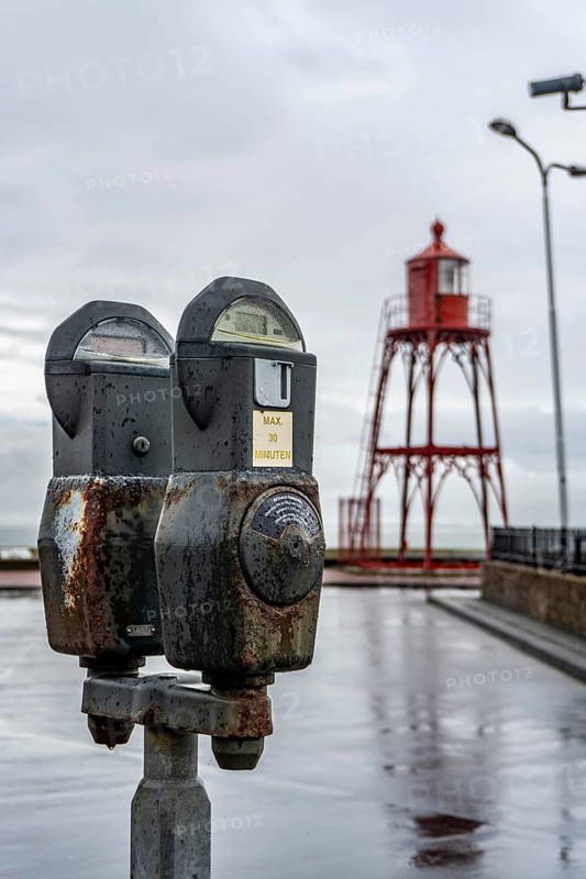 Parking meters, analogue, mechanical, still in operation, on Boulevard Ruyter, on the former casemates at the harbour entrance of Vlissingen, Zeeland, Netherlands