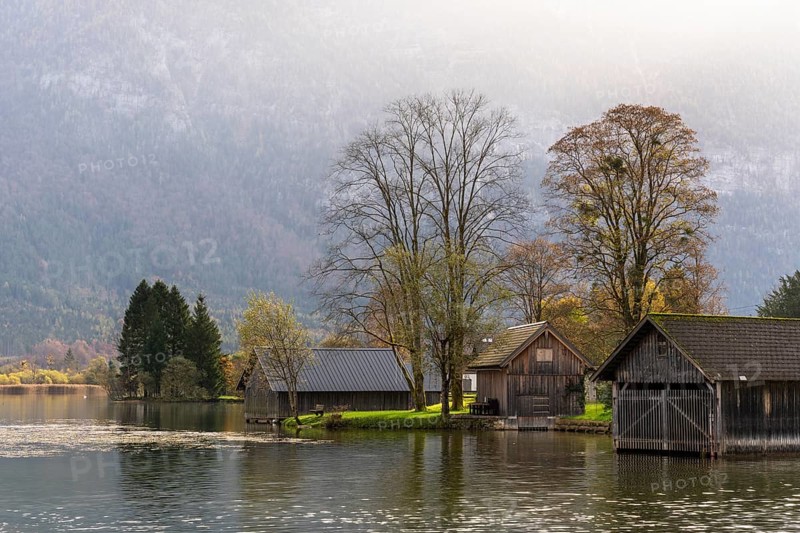 Lake Hallstatt near Steeg. Some boathouses. Autumn, backlight. Lake Hallstatt, Salzkammergut, Upper Austria, Austria, Europe