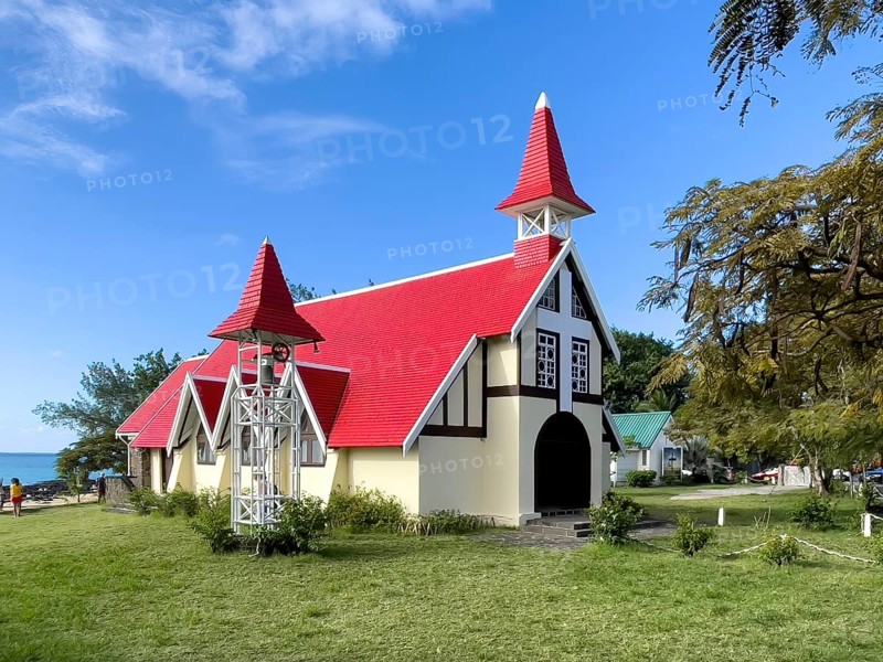 Excursion destination Photo motif for tourists Church of Notre-Dame Auxiliatrice de Cap Malheureux by the sea in the background Indian Ocean, Cap Malheureux, Mauritius, Africa