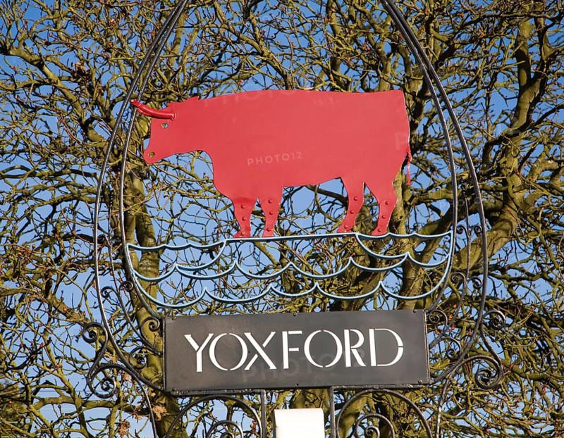 Red bull village sign Yoxford, Suffolk, England, United Kingdom, Europe