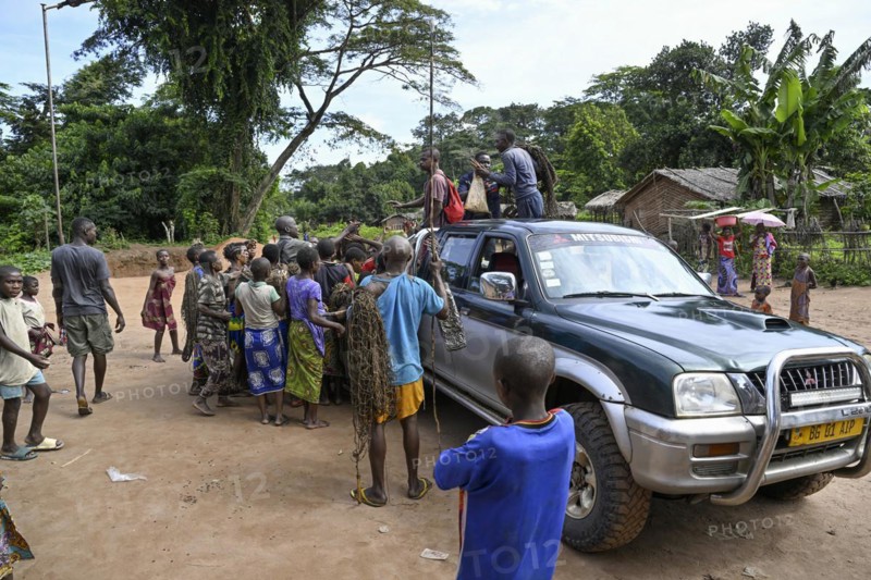 Pygmies of the Baka or BaAka people on a pickup truck, Bayanga, Sangha-Mbaéré Prefecture, Central African Republic, Africa