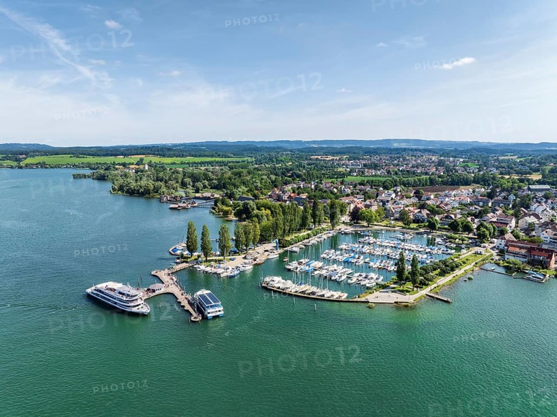 The yacht harbour, marina, harbour of Unteruhdlingen, Uhldingen-Mühlhofen with the passenger ship MS Überlingen of the Lake Constance-Schiffsbetriebe, behind it the pile dwellings, pile dwelling museum, Lake Constance district, Lake Constance, Baden-Württemberg, Germany, Europe