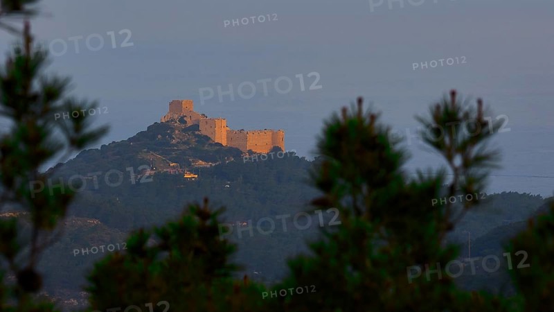 A castle on a hill in the first morning light, surrounded by trees at dusk, Kritinia Castle, St John's Castle, Kritinia, Rhodes, Dodecanese, Greek Islands, Greece, Europe