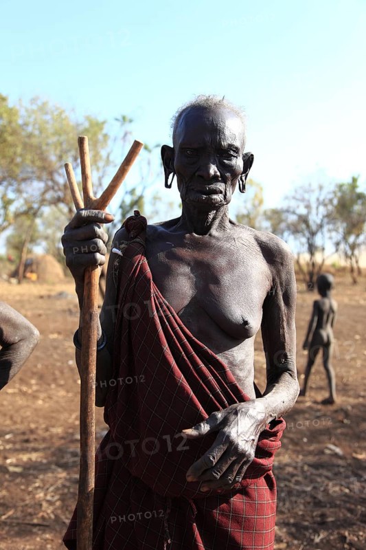 South Ethiopia, in the Maco National Park, in the village of the Mursi, old Mursi woman, with naked head, Ethiopia, Africa