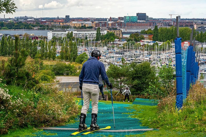 CopenHill, waste incineration plant and artificial ski slope, skiing with a view of Margretheholms Havn marina, ski lift, 90 metres high and 400 metre long slope on artificial turf, Copenhagen, Denmark, Europe