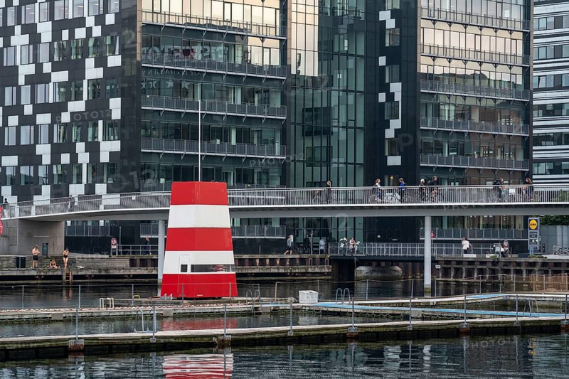 Cyclists on the Cykelslangen cycle and footpath bridge, at the Fisketorvet shopping centre, across the harbour, harbour outdoor pool, Sydhavnen, Copenhagen is considered the cycling capital of the world, 45 % of the population travel by bike, Denmark, Europe