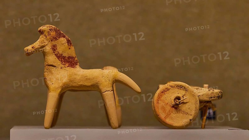 Ancient children's toy, Two simple clay figurines depicting a horse and parts of a cart, Archaeological Museum, Archea Korinthos, Corinth, Peloponnese, Greece, Europe