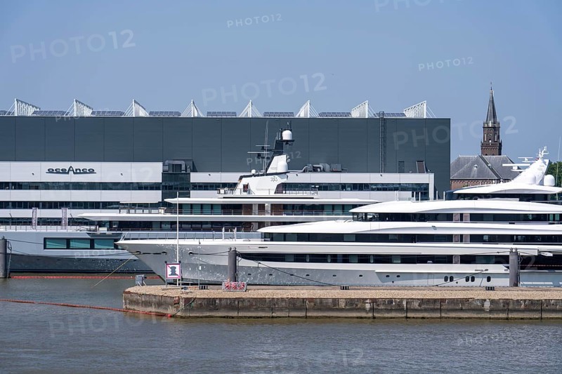 Oceanco shipyard in Alblasserdam, specialising in the construction of mega yachts, luxury yachts, on the river Noord, South Holland, in front the H3 yacht, 105 metres long, completely renovated, rebuilt, behind the superyacht Seven Seas Yacht, 109 metres long, owned by Steven Spielberg, Netherlands