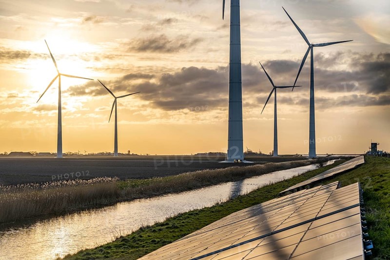 Solar park on the Slaperdijk dyke near the Eemshaven, test project, 17, 000 solar modules were installed over a good 5 kilometres, the Netherlands has over 22, 000 kilometres of dyke line, here it is being tested whether such an installation is successful and can be expanded, wind farm, Groningen, Netherlands