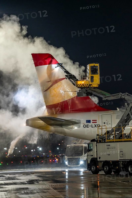 Winter at Frankfurt Main Airport, FRA, Austrian aircraft being de-iced by de-icing vehicles, Hesse, Germany, Europe