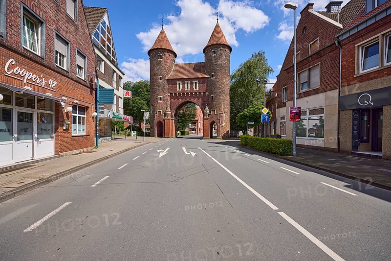 Lüdinghauser Tor town gate with Lüdinghauser Strasse and brick buildings in Dülmen, Münsterland, Coesfeld district, North Rhine-Westphalia, Germany, Europe