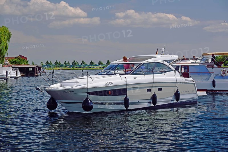 Europe, Germany, Mecklenburg-Western Pomerania, island town of Malchow, Lake Malchow, at the swing bridge, motor yacht, Malchow, Mecklenburg-Western Pomerania, Germany, Europe