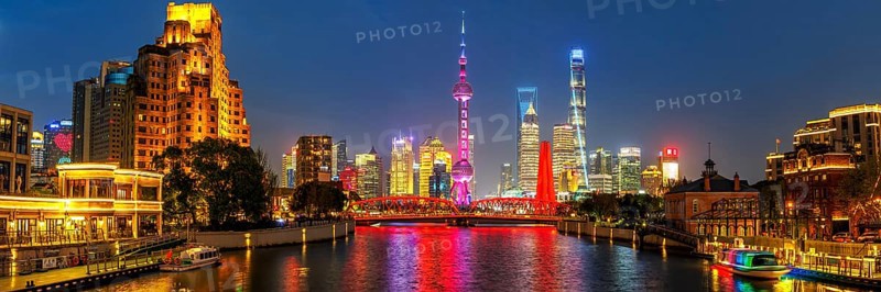 Shanghai skyline at the Bund with Oriental Pearl Tower city centre downtown panorama at night in Shanghai, China, Asia
