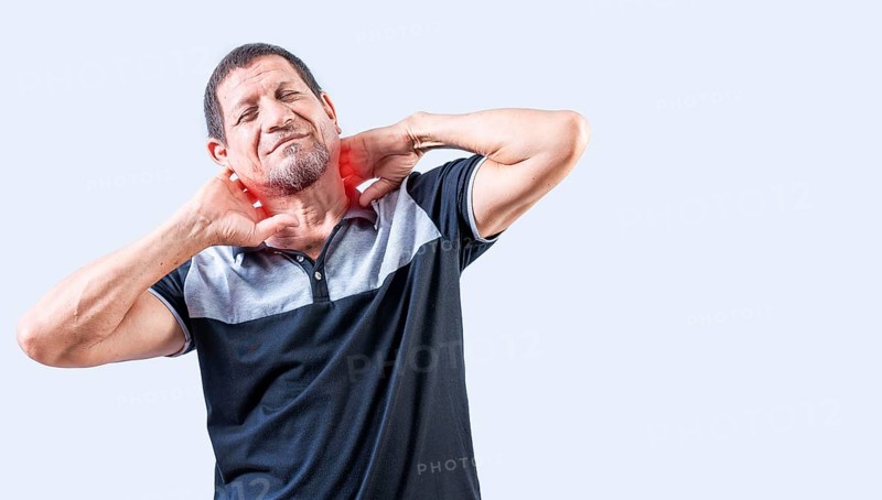 Neck pain and stress concept. Elderly person suffering with neck pain isolated. Mature man with neck tension isolated