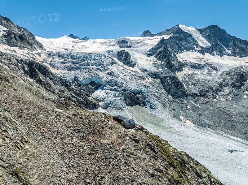 Mountain hut Cabane de Moiry, located close to the retreating Moiry glacier, hiking trail, aerial view, Valais, Switzerland, Europe
