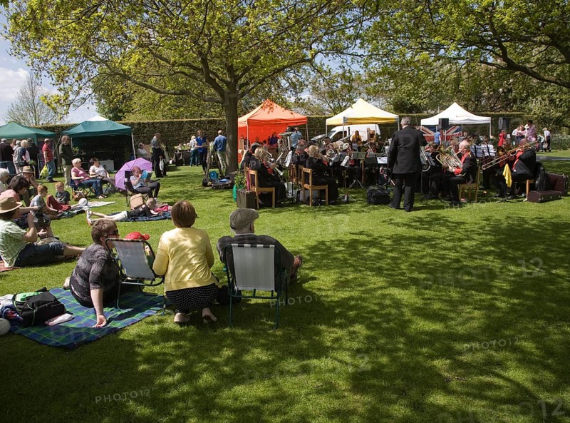 People watching a brass band perform during a country fair, Helmingham Hall, Suffolk, England, United Kingdom, Europe